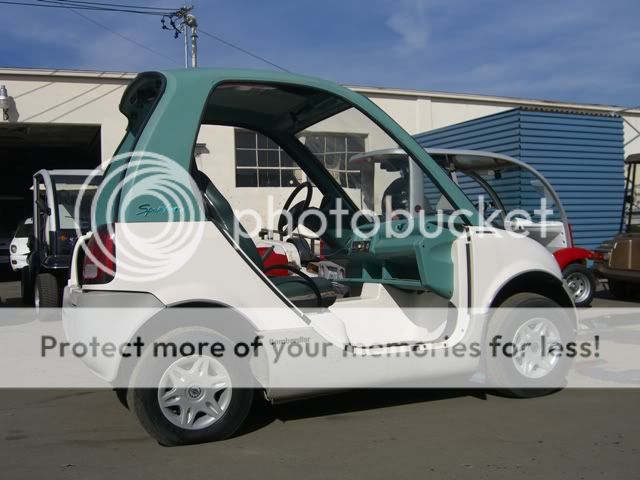 1999 Bombardier electric vehicle golf cart with two passenger seats